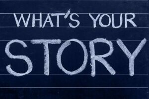 chalk board with 'What's your story'