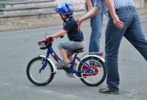 A child learning to bike